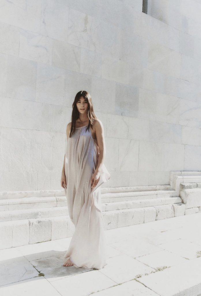 Girl at a marble wall